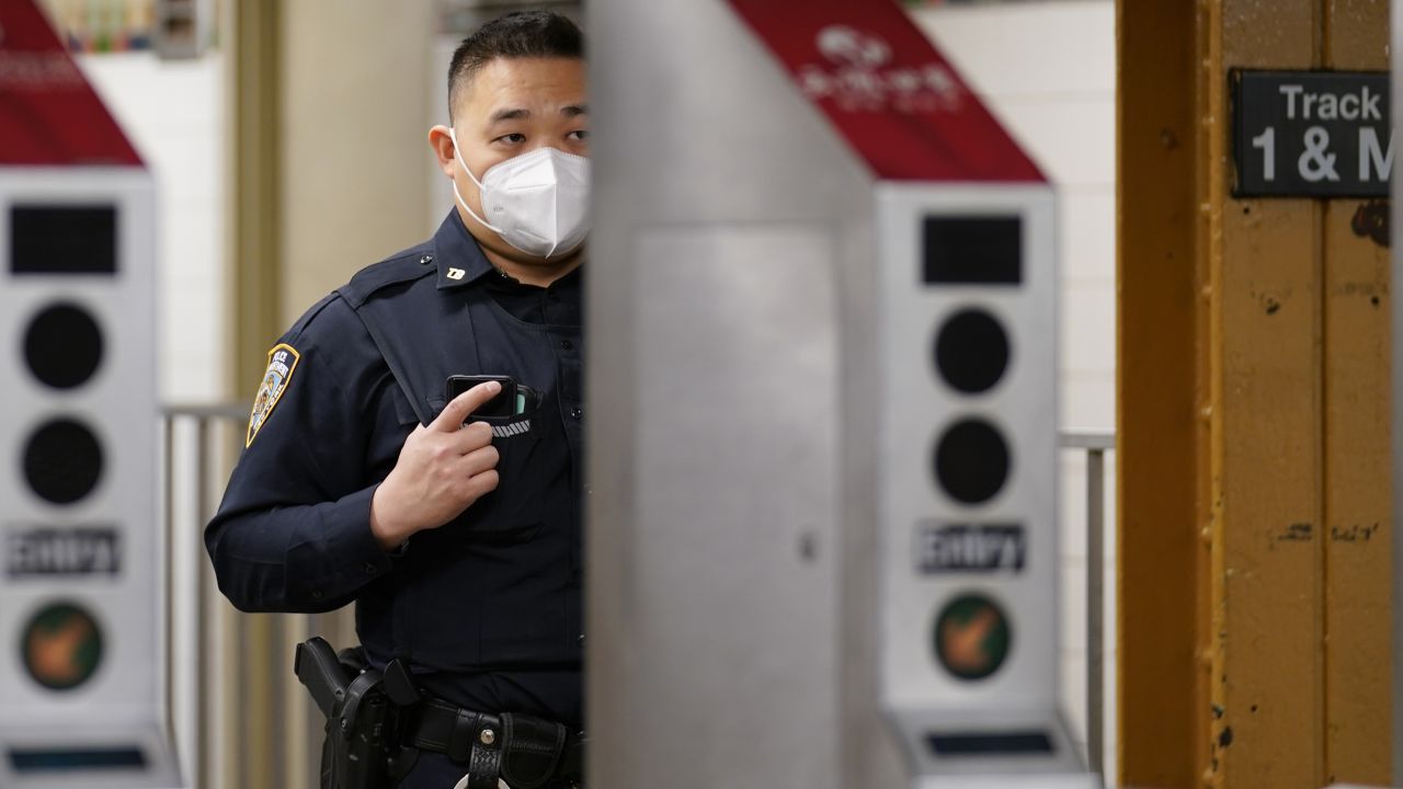 A law enforcement officer in New York is seen at a subway station on March 30, 2021, in the largely Asian American neighborhood of Flushing.