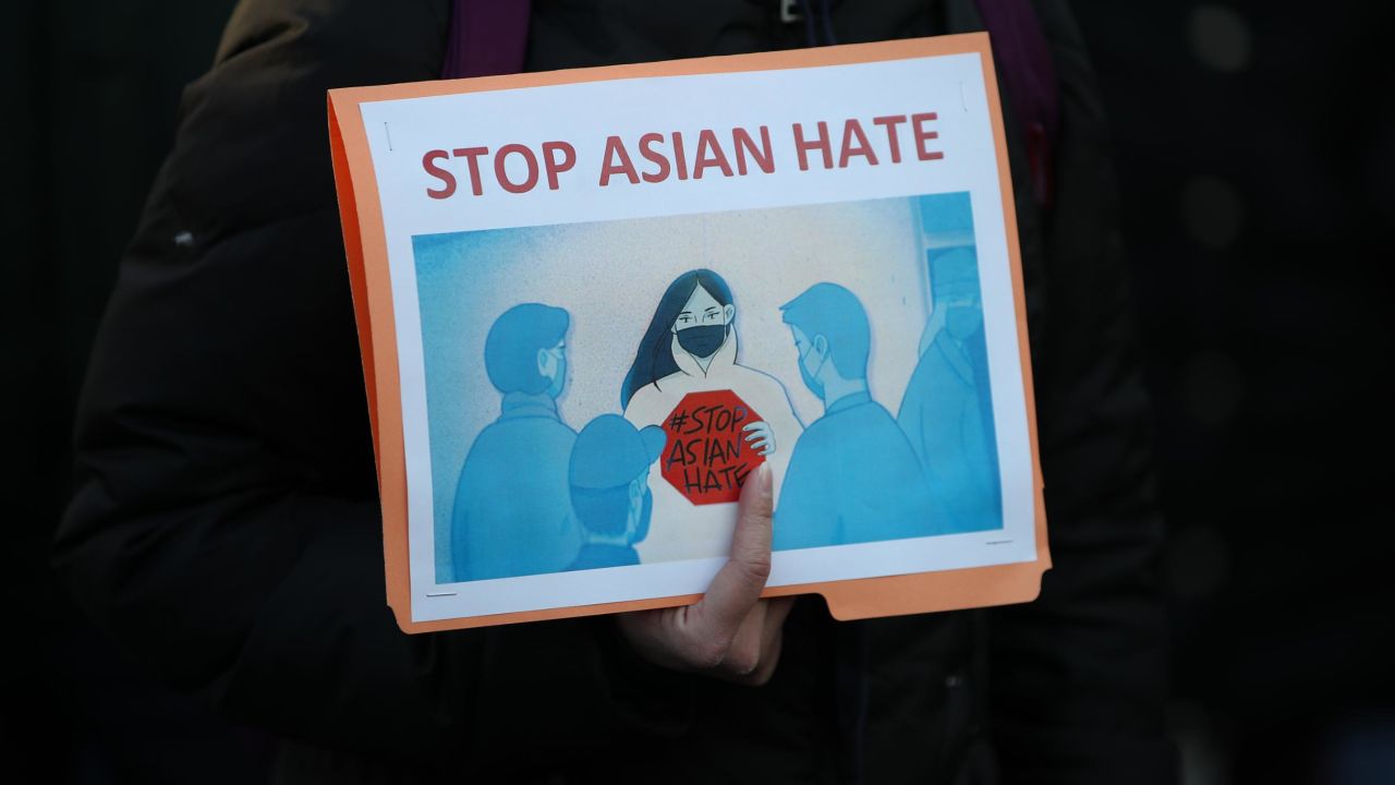 This sign was seen at a March 19, 2021, vigil for victims of the Atlanta spa shooting in New York.