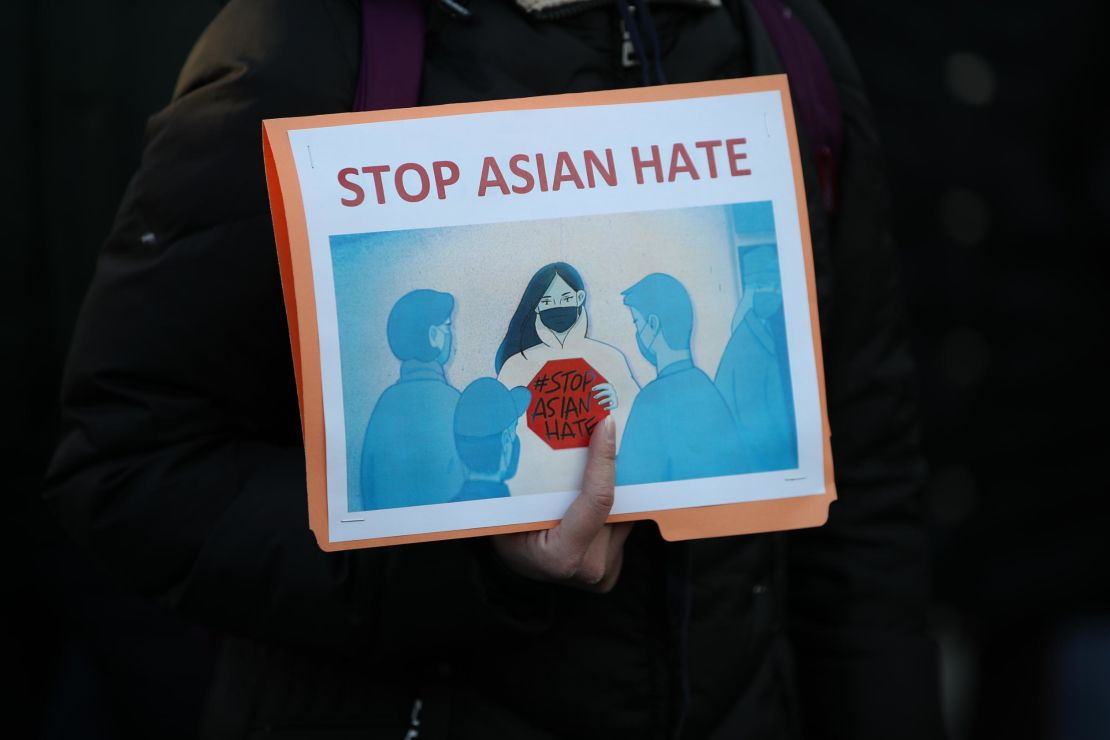 This sign was seen at a March 19, 2021, vigil for victims of the Atlanta spa shooting in New York.