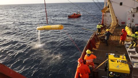 An autonomous underwater vehicle is recovered after completing a seafloor mapping mission in the Arctic Ocean. The remotely operated vehicle (foreground) is used to conduct visual surveys of the newly mapped seafloor.                                