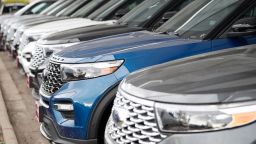 In this Sunday, Oct. 20, 2019, photograph, a long row of unsold 2020 Explorers sits at a Ford dealership in Littleton, Colo. (AP Photo/David Zalubowski)