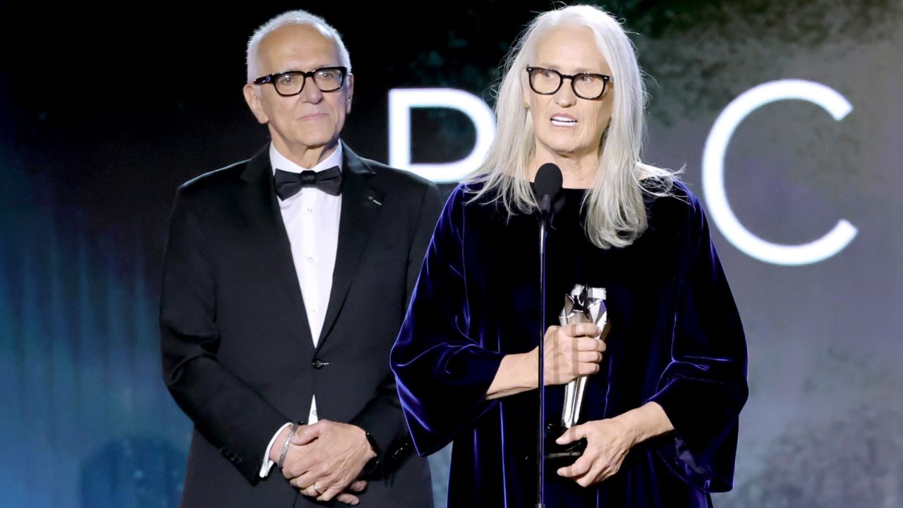 (From left) Roger Frappier looks on as Jane Campion accepts the best picture award for "The Power of the Dog" during the 27th Annual Critics Choice Awards at LA's Fairmont Century Plaza on March 13.