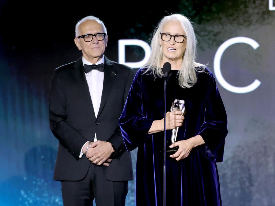 Roger Frappier, left, looks on as Jane Campion accepts the Best Picture award for "The Power of the Dog" onstage during the 27th Annual Critics Choice Awards at Fairmont Century Plaza on March 13, 2022, in Los Angeles.