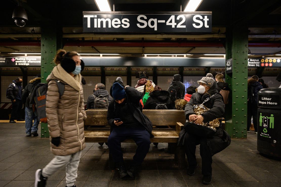 Commuters wait for a train at the Times Square subway station days after Michelle Go was pushed from a subway platform there and killed.