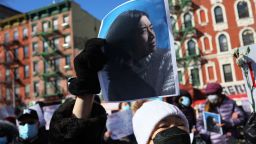 A person holds a photo of Christina Yuna Lee as people gather for a rally protesting violence against Asian-Americans at Sara D. Roosevelt Park on February 14, 2022 in the Chinatown neighborhood in New York City. 