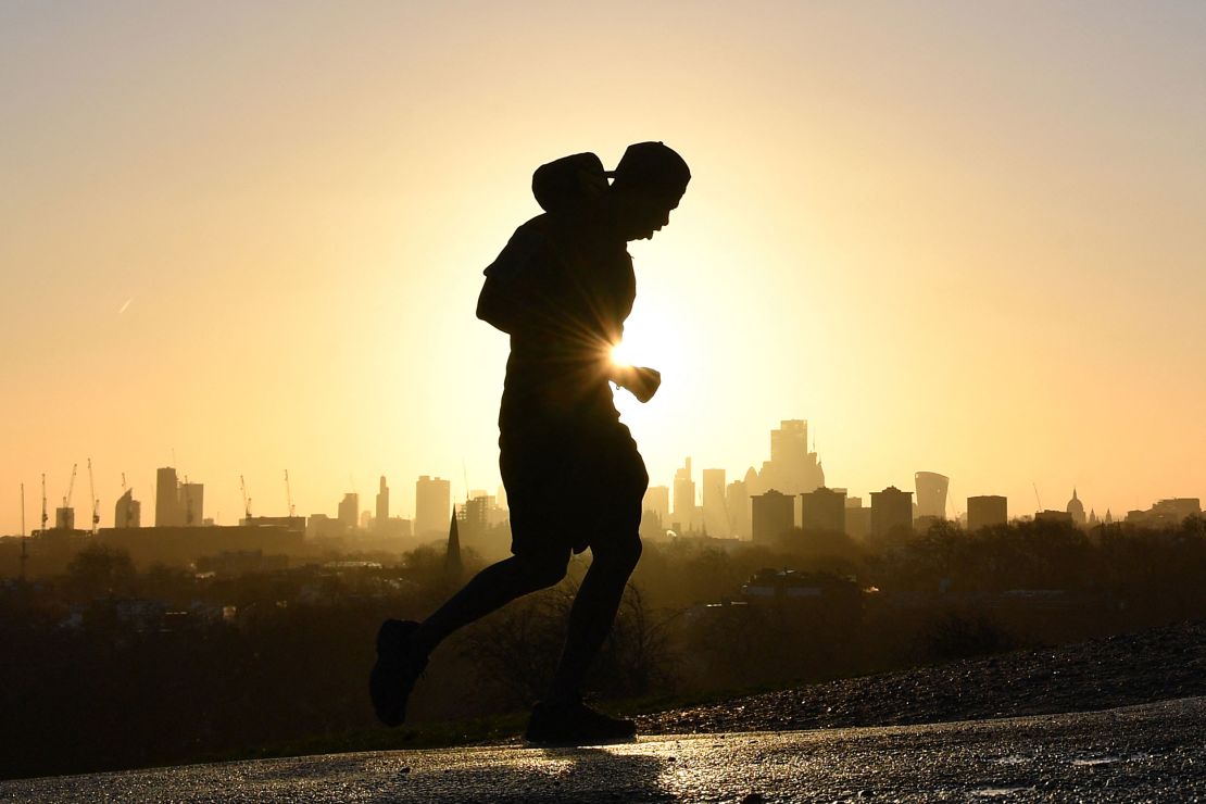 A full-body workout like running or swimming burns the most calories. A jogger runs up Primrose Hill in London on February 17.