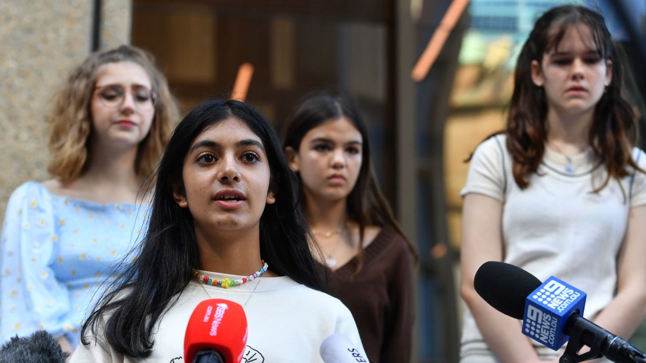 Anjali Sharma (center) speaks to the media the New South Wales Federal Court in Sydney, Tuesday, March 15, 2022.
