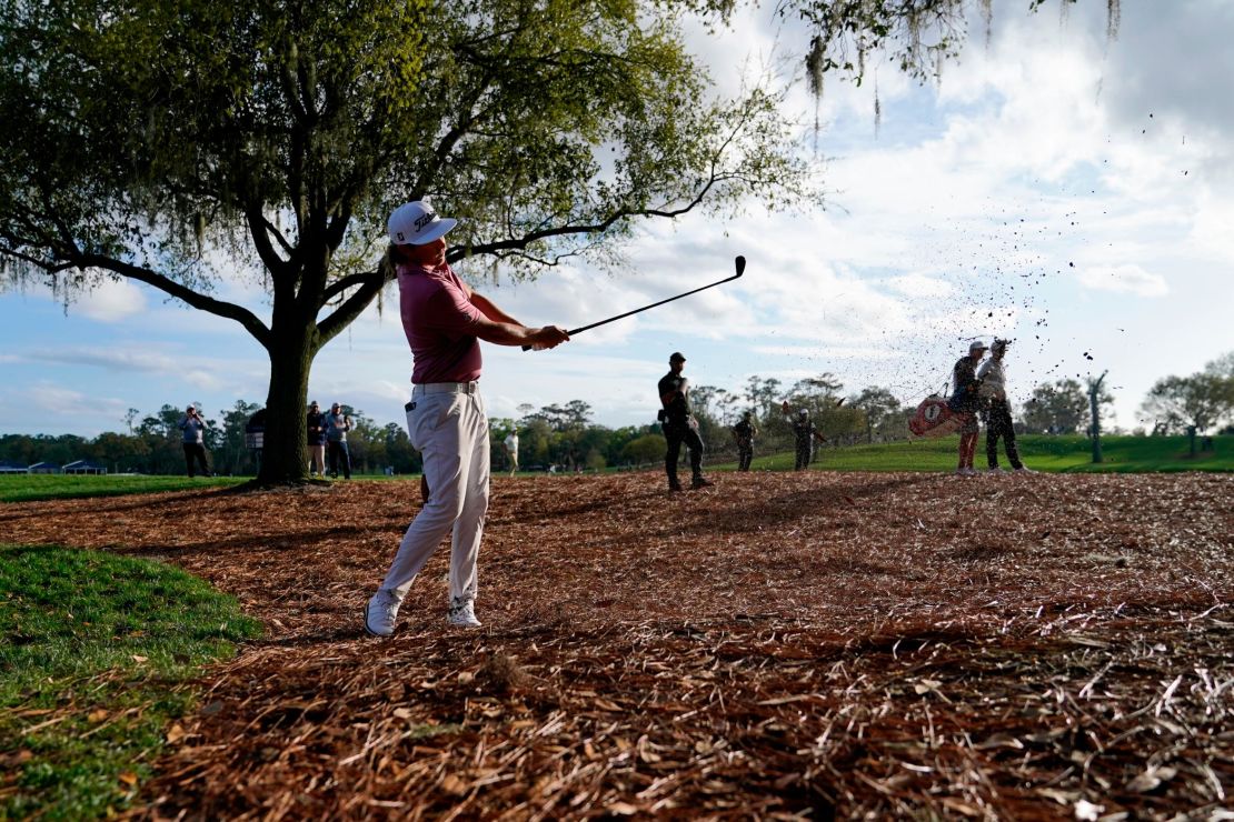 Smith hits out of the pine straw along the 18th fairway during the final round of the Players Championship.