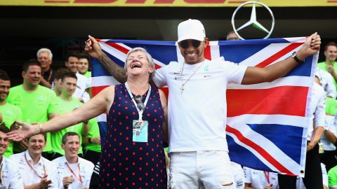 Lewis Hamilton celebrates with his mother, Carmen Larbalestier, after winning his fourth F1 World Drivers Championship in 2017.