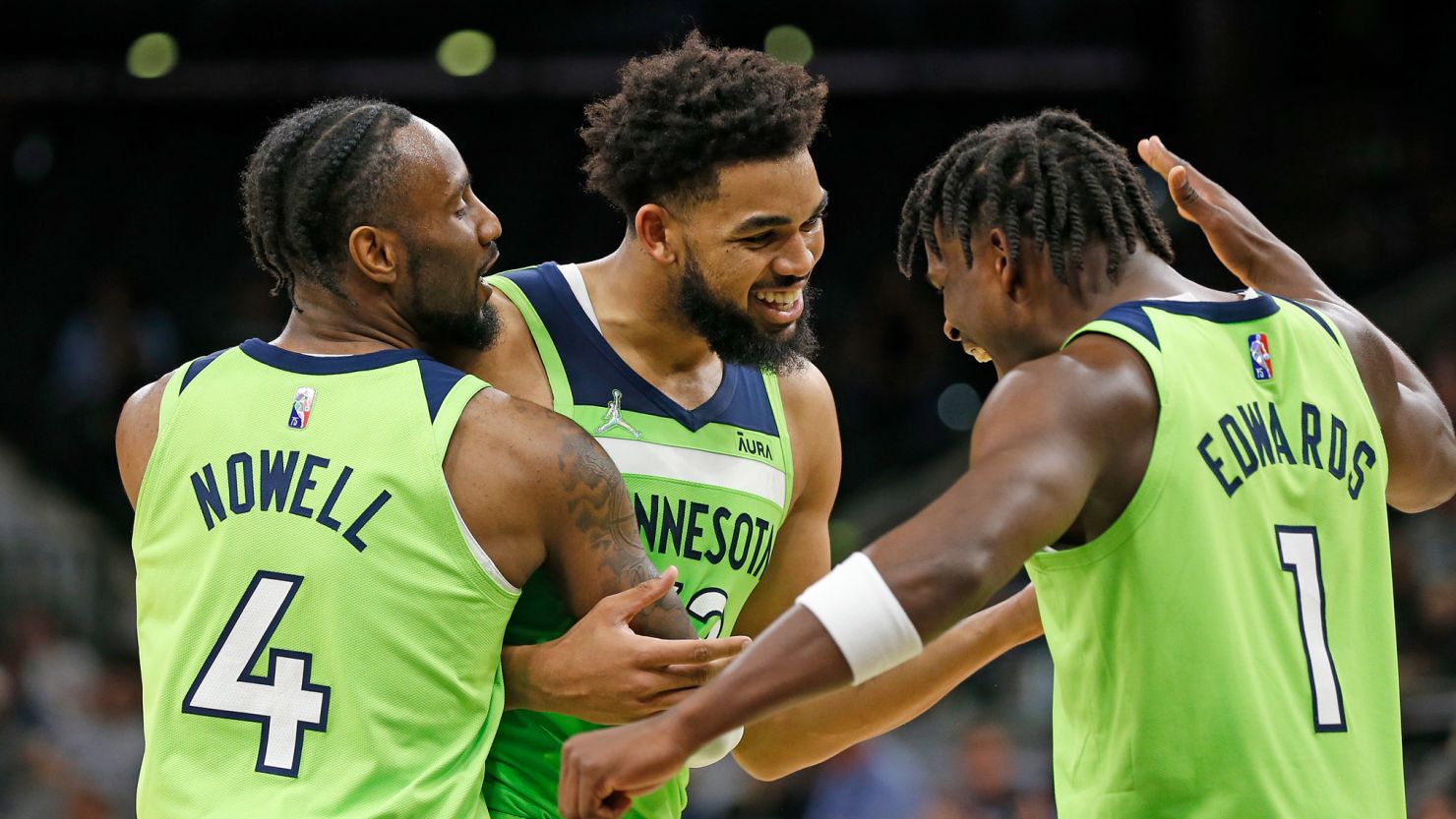 Karl-Anthony Towns receives congratulations from teammates Jaylen Nowell and Anthony Edwards after scoring 60 points against the San Antonio Spurs.