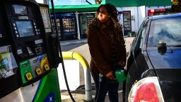 Holtsville, N.Y. Alexis Nicolas of Islandia, New York, fuels up her car at the BP gas station on the Long Island Expressway North Service Road in Holtsville, New York, on February 23, 2022.