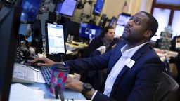 Trader Aaron Ford works on the New York Stock Exchange floor on Friday, March 11, 2022. 