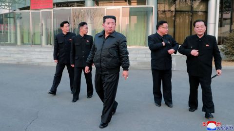 This undated picture released from North Korea's official Korean Central News Agency (KCNA) on March 10, 2022 shows North Korean leader Kim Jong Un (C) inspecting the country's Aerospace Development Administration in Pyongyang. 