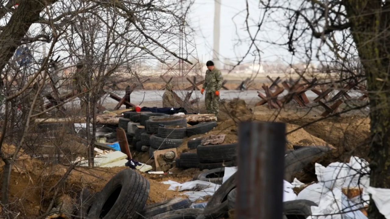 Ukrainian positions nearby are crude: trenches dug in the farmland along a highway pock-marked with shell impacts.