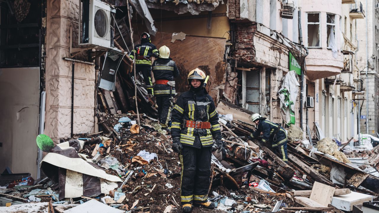 Firefighters work Monday at a building destroyed by a Russian shell in Kharkov, Ukraine.