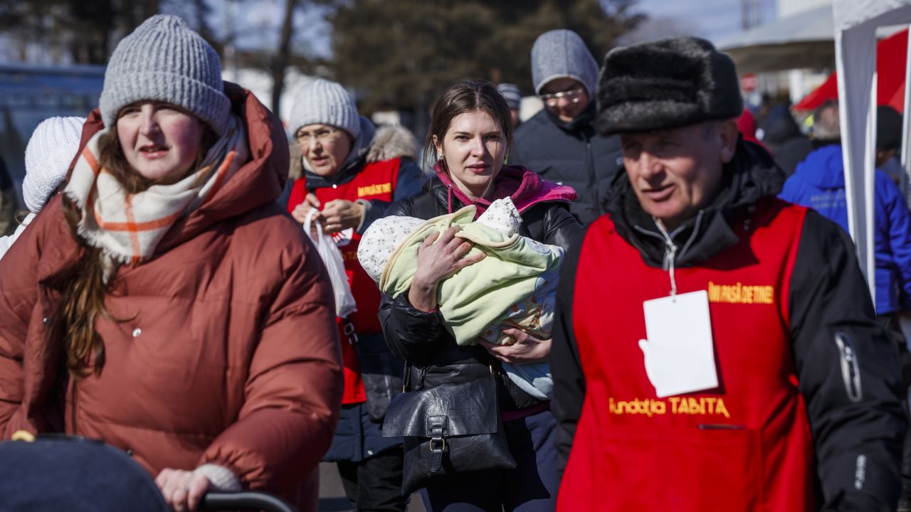 Refugees from Ukraine arrive March 9 at the Siret border post in Romania.