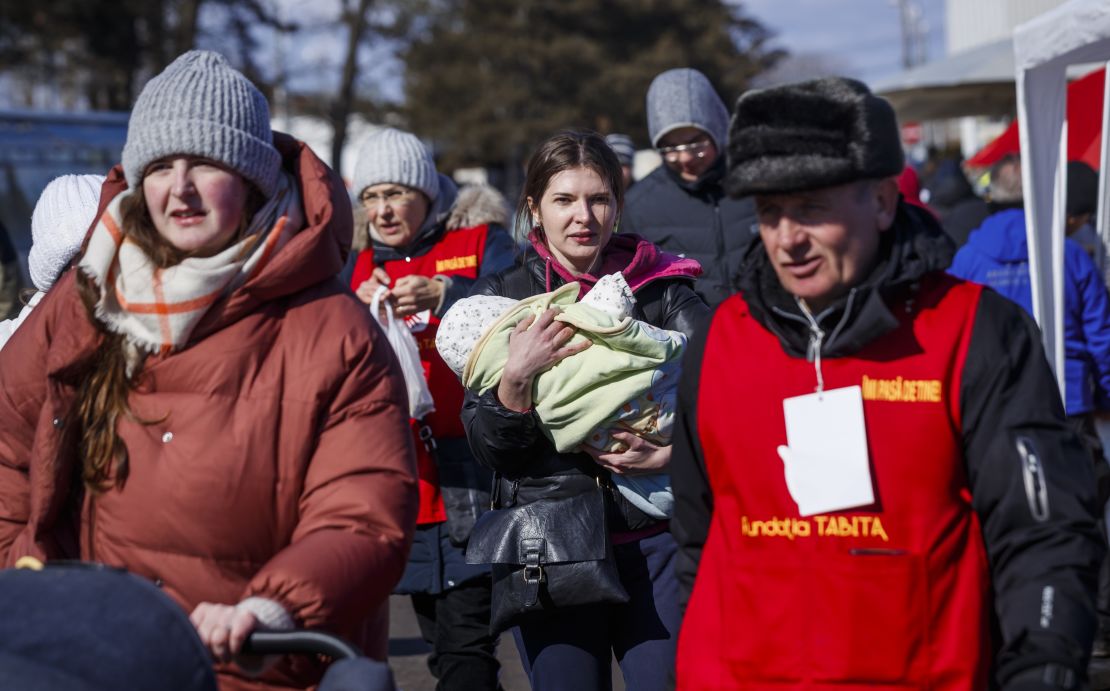 Refugees from Ukraine arrive March 9 at the Siret border post in Romania.