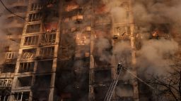 Firefighters extinguish fires in an apartment building after being hit by shelling in Kyiv, Ukraine, Tuesday, March 15, 2022. (AP Photo/Felipe Dana)