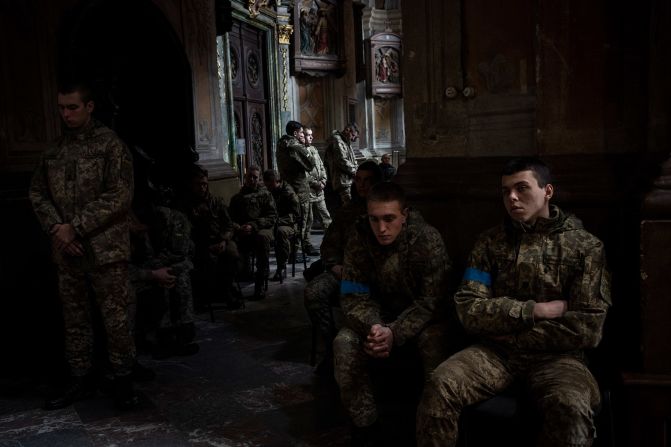 Military cadets attend a funeral ceremony at a church in Lviv on March 15. The funeral was for four of the Ukrainian servicemen who were killed during <a href="index.php?page=&url=https%3A%2F%2Fwww.cnn.com%2F2022%2F03%2F13%2Feurope%2Frussia-invasion-ukraine-03-13-intl-hnk%2Findex.html" target="_blank">an airstrike on the Yavoriv military base</a> near the Polish border. Local authorities say 35 people were killed.