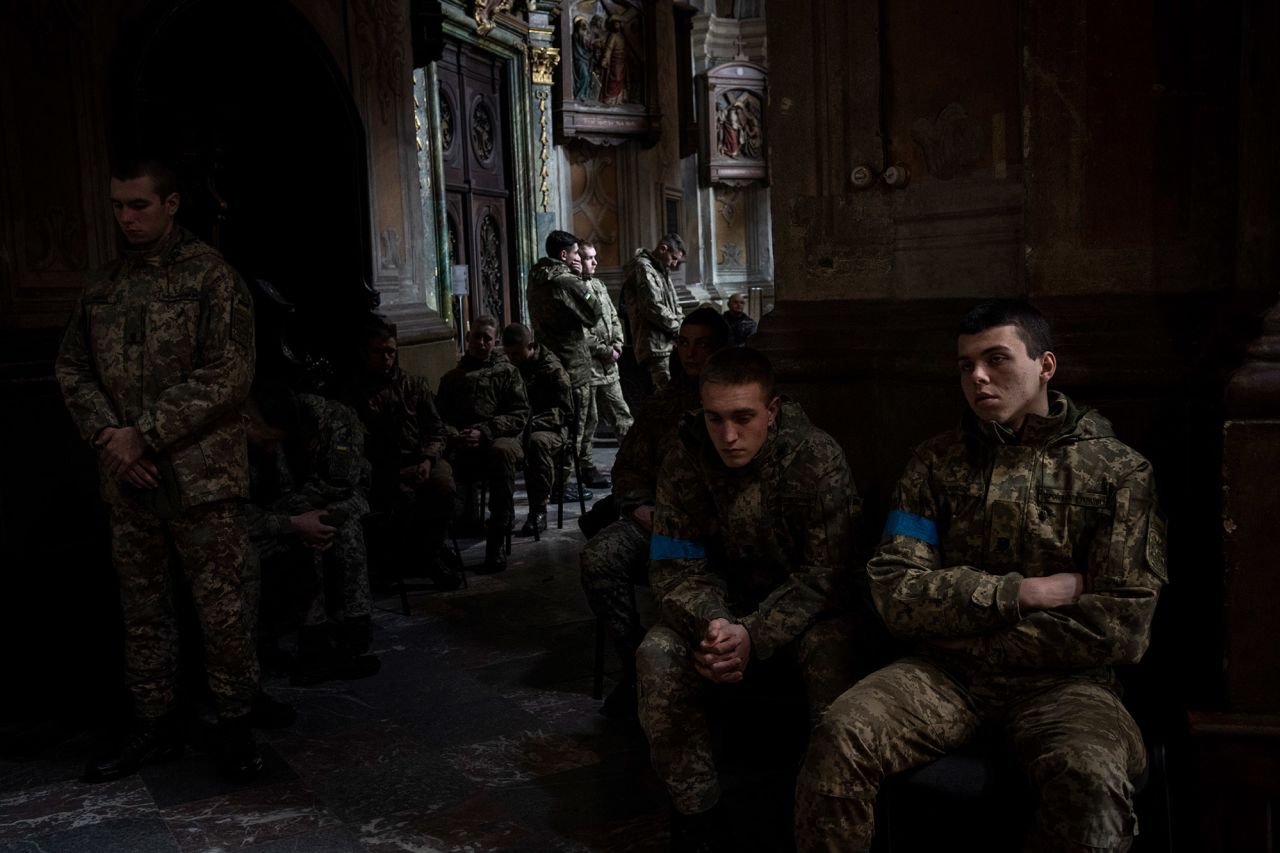Military cadets attend a funeral ceremony at a church in Lviv on March 15. The funeral was for four of the Ukrainian servicemen who were killed during <a target=