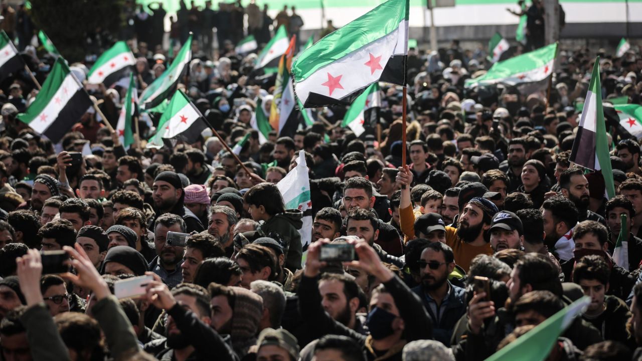Syrians in the city of Idlib take part in a protest against the Syrian regime on March 14 to mark the 11th anniversary of the Syrian uprising.