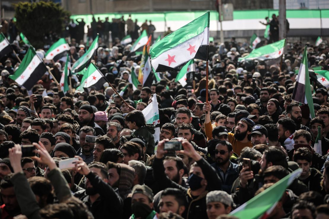 Syrians in the city of Idlib take part in a protest against the Syrian regime on March 14 to mark the 11th anniversary of the Syrian uprising.   