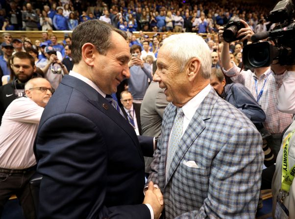 Krzyzewski greets North Carolina head coach Roy Williams before a game in 2018. <a href="index.php?page=&url=https%3A%2F%2Fwww.cnn.com%2F2021%2F04%2F01%2Fus%2Froy-williams-unc-basketball-retirement-spt%2Findex.html" target="_blank">Williams retired in April 2021</a> as head coach of the Tar Heels, Duke's archrival.