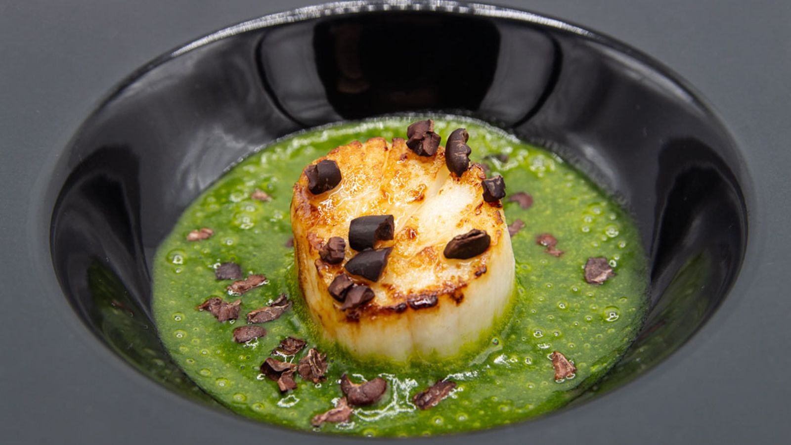 <strong>Whale food:</strong> Braschi's scallop with cocoa beans sits in a foam made from plankton.