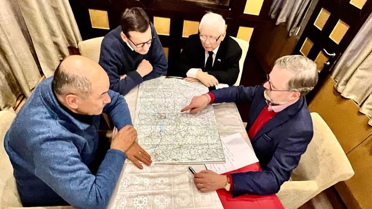 From left: Slovenia's Prime Minister Janez Janša, Polish Prime Minister Mateusz Morawiecki, Polish deputy Prime Minister Jarosław Kaczyński and Czech Prime Minister Petr Fiala study a map of Ukraine in an undisclosed location Tuesday.