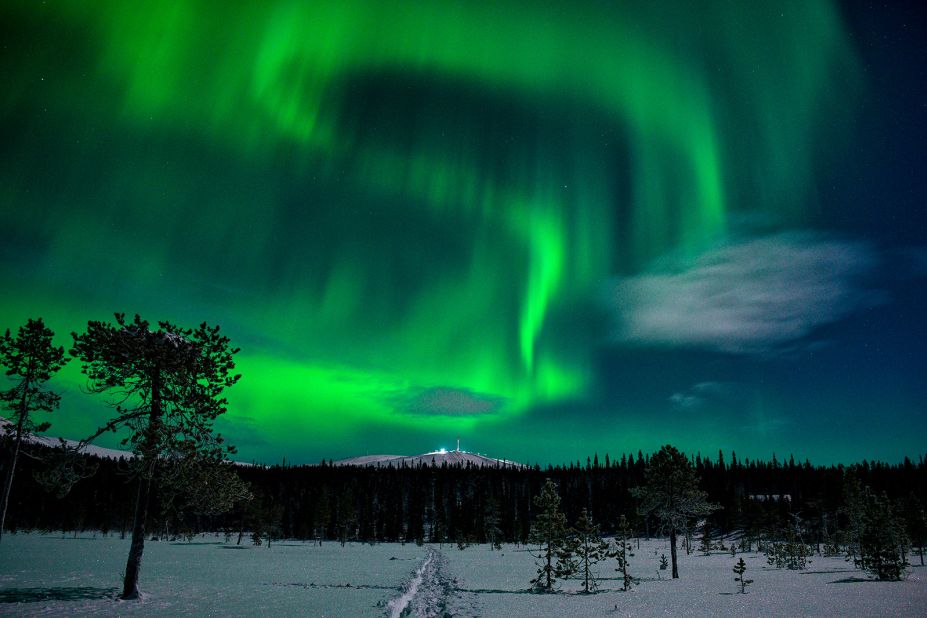 <strong>Finland is the world's happiest country.</strong> The World Happiness Report puts Finland first in happiness. Here, northern lights illuminate the night sky in Finland's Lapland.