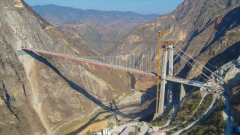 YUXI, CHINA - MARCH 08: Aerial view of the construction site of Lvzhijiang Bridge, the world's largest single-tower, single-span suspension bridge, on March 8, 2022 in Yuxi, Yunnan Province of China. The closure of Lvzhijiang Bridge will be finished on Wednesday. The bridge measures 798 meters long and has a single span of 780 meters. (Photo by Yao Sichao/VCG via Getty Images)
