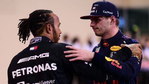 2021 F1 World Drivers Champion Max Verstappen is congratulated by runner up Lewis Hamilton after the Abu Dhabi Grand Prix. 