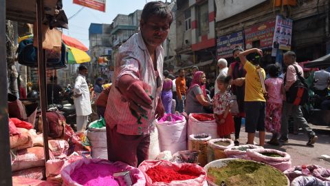 Market people shopping for Holi at a market in New Delhi.