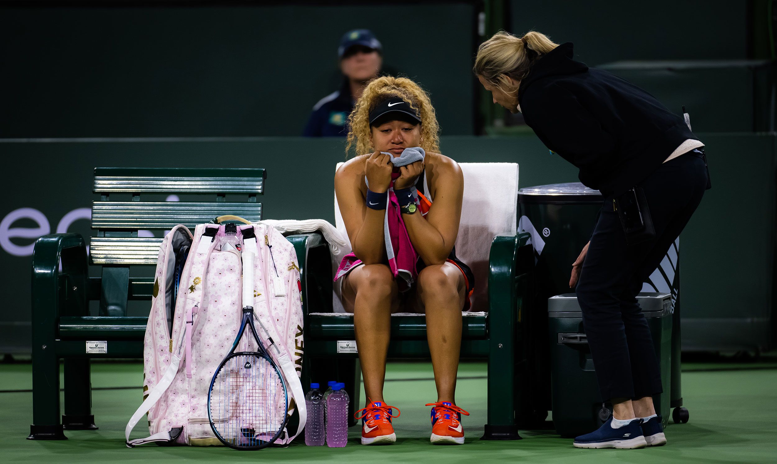 Tennis star Naomi Osaka talks to referee Clare Wood after being heckled by a fan during a match in Indian Wells, California, on Saturday, March 12. The fan appeared to yell out 'Naomi, you suck,' bringing her to tears on the court.