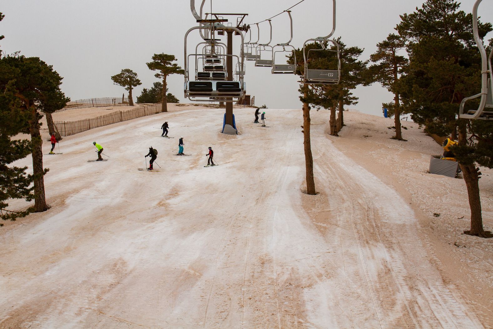 People ski at the Navacerrada ski resort in Madrid on Wednesday, March 16. Strong winds from Storm Celia, off the northwest coast of Africa, picked up dust from the Sahara desert and lofted it into the atmosphere. The southerly winds then <a href="index.php?page=&url=https%3A%2F%2Fwww.cnn.com%2F2022%2F03%2F16%2Fweather%2Fsaharan-dust-europe%2Findex.html" target="_blank">pushed the dust northward into Europe.</a>