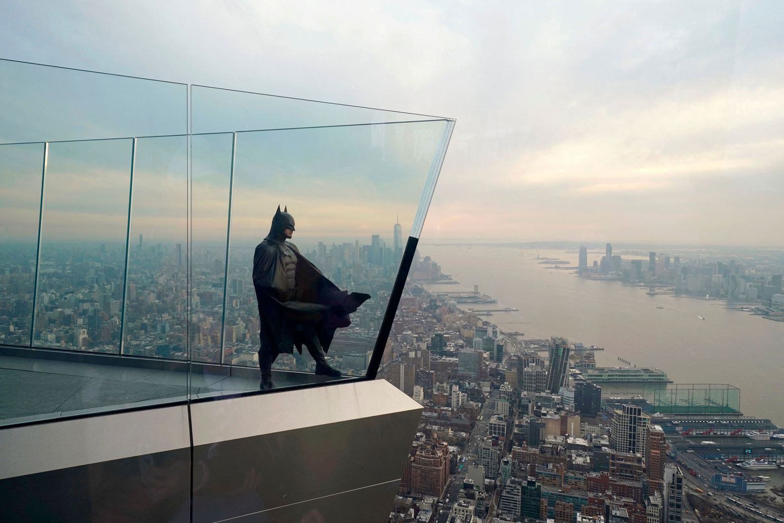 Dom Charland, dressed as Batman, looks out over New York City as he poses on the Edge, an outdoor observation deck, on Thursday, March 10. 