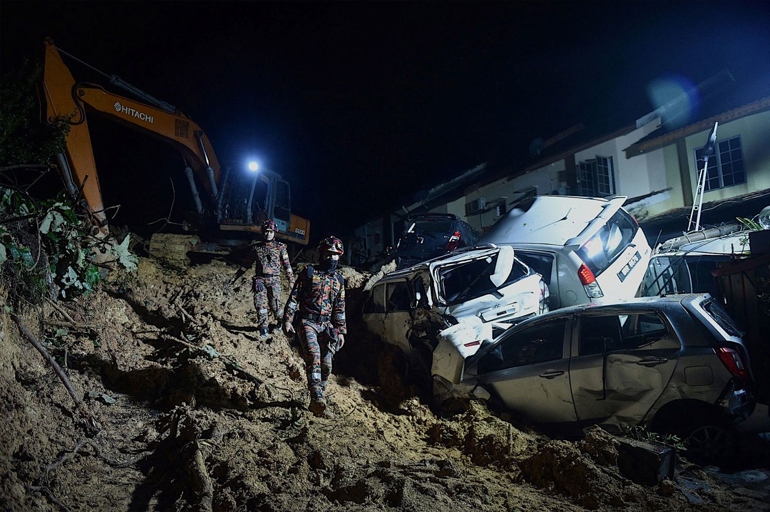 Rescue workers search for victims after a landslide was triggered by heavy rains in Kuala Lumpur, Malaysia, on Friday, March 11.