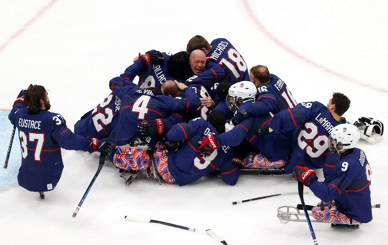 The United States hockey team celebrates Sunday, March 13, after winning the gold medal at the Winter Paralympics in Beijing.
