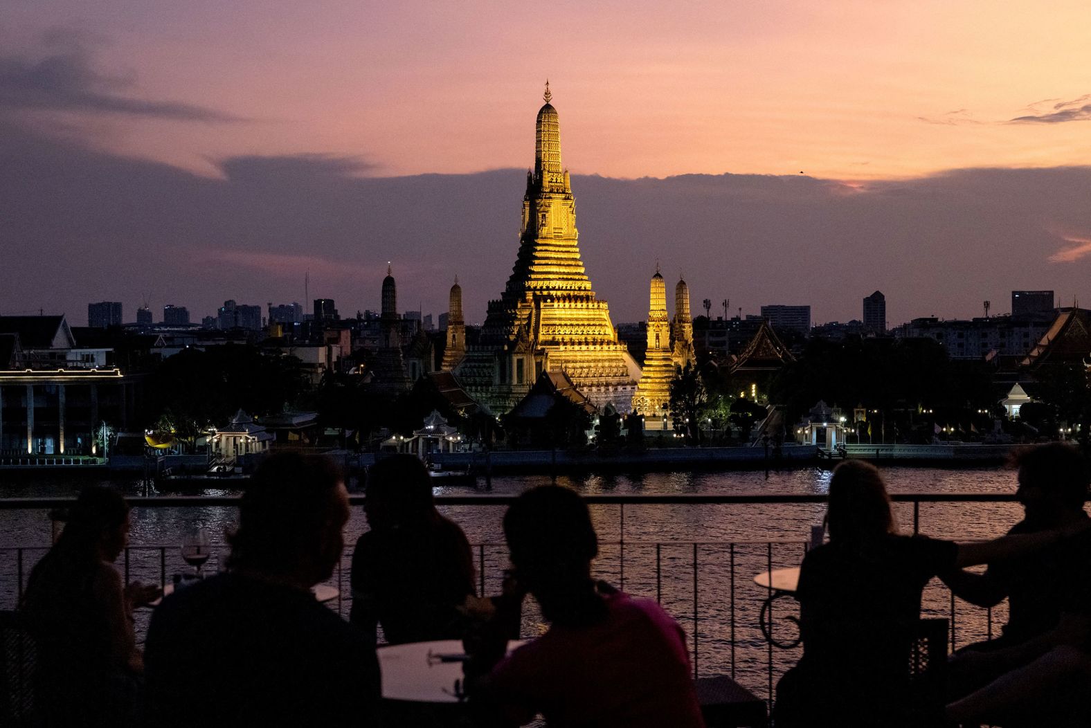 The Wat Arun Buddhist temple is illuminated at dusk Thursday, March 17, in Bangkok, Thailand. <a href="index.php?page=&url=http%3A%2F%2Fwww.cnn.com%2F2022%2F03%2F10%2Fworld%2Fgallery%2Fphotos-this-week-march-3-march-10%2Findex.html" target="_blank">See last week in 30 photos.</a>