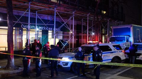 Police investigate after a homeless man was found shot to death on Murray Street and Greenwich Street in New York City on Sunday.