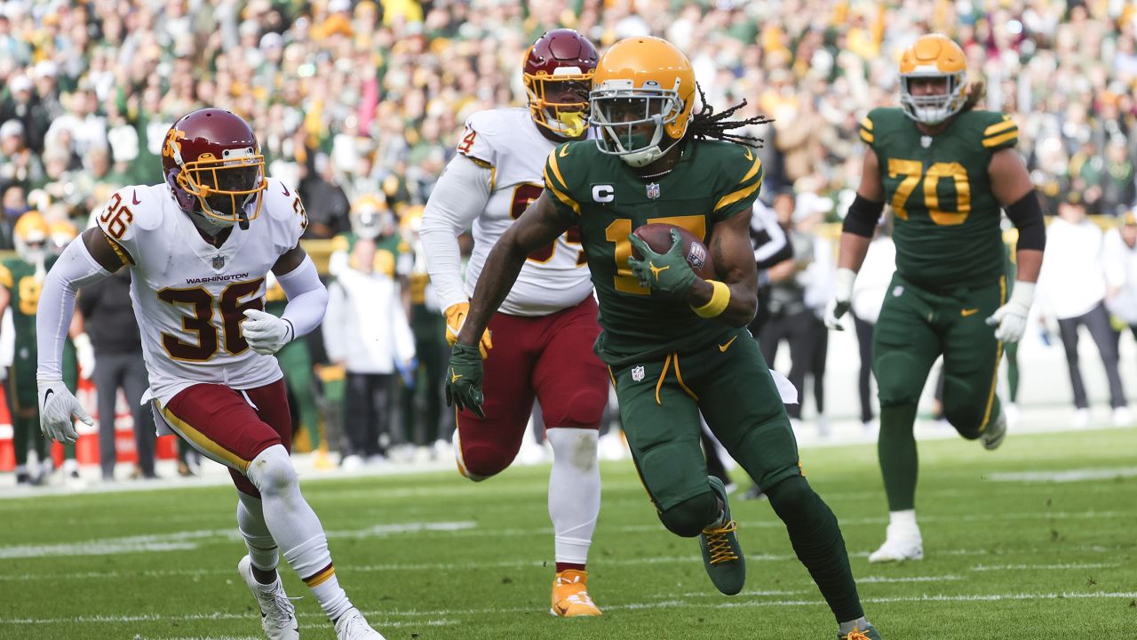 Davante Adams #17 of the Green Bay Packers runs with the ball against the Washington Football Team in the game at Lambeau Field on October 24, 2021 in Green Bay, Wisconsin.