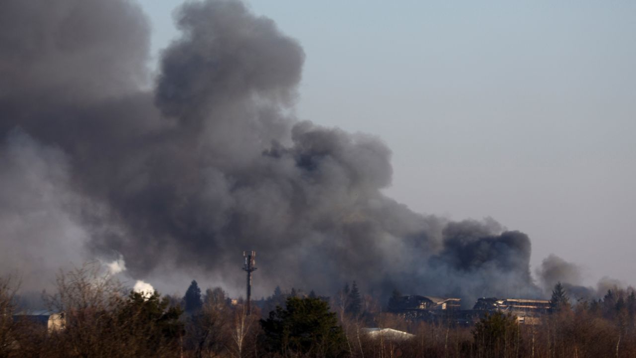 Smoke rises from a factory building near Lviv airport, as Russia's invasion of Ukraine continues, in Lviv, Ukraine, March 18, 2022. REUTERS/Kai Pfaffenbach