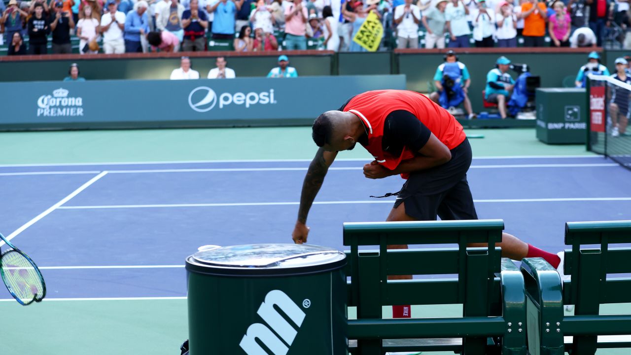 Nick Kyrgios smashes his racket after his three-set defeat to Rafael Nadal.