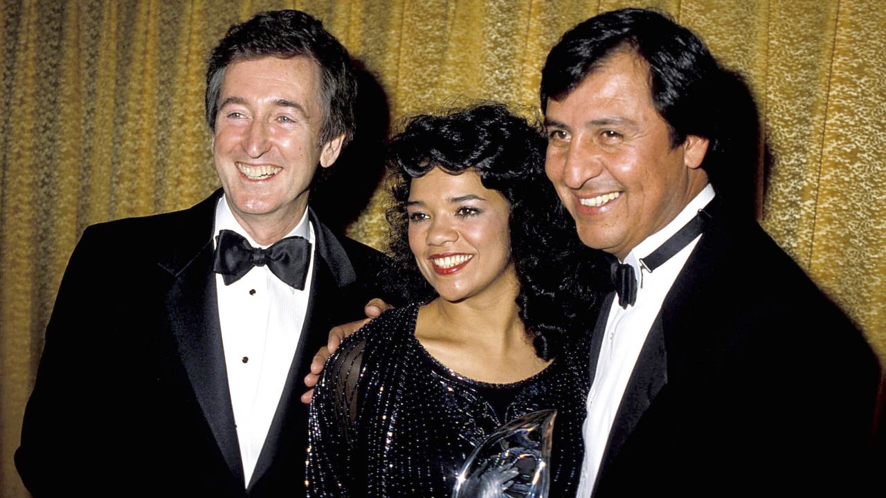 Manzano and Delgado (pictured with co-star Bob McGrath, left) were good friends off-screen and played a married couple on "Sesame Street."