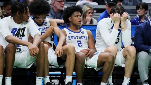 The Wildcats bench reacts during the overtime period against the Saint Peter's Peacocks.