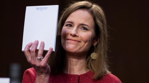 Then-nominee Amy Coney Barrett holds up her notepad at the request of Sen. John Cornyn on the second day of her confirmation hearing.