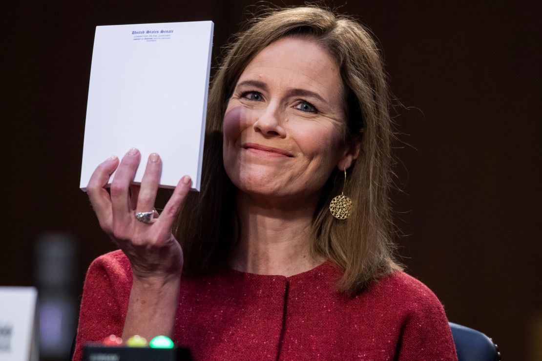 Then-nominee Amy Coney Barrett holds up her notepad at the request of Sen. John Cornyn on the second day of her confirmation hearing.