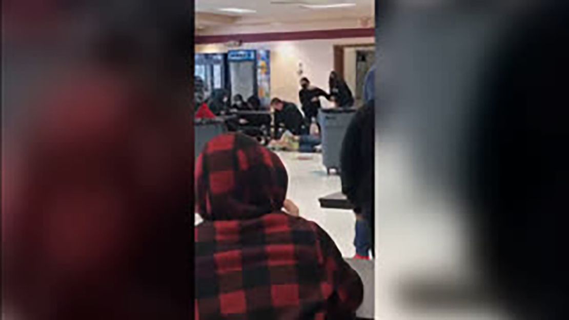 Social media video released earlier appeared to show a fight between two students as the off-duty officer attempted to break it up before either being hit or falling backward. Shortly after, he is seen on top of the student.