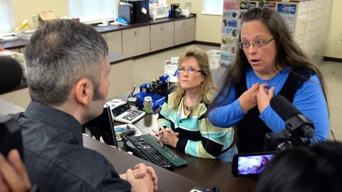 Rowan County Clerk Kim Davis, right, talks with David Moore following her office's refusal to issue marriage licenses at the county courthouse in Morehead, Kentucky, on September 1, 2015.