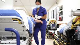 Lab technician Alejandra Sanchez cares for a patient in the Emergency Department at Providence St. Mary Medical Center on March 11, 2022 in Apple Valley, California.